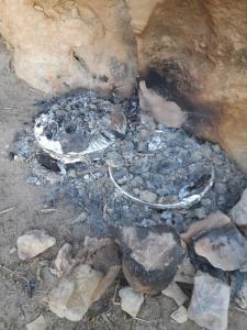 una pila de escombros y rocas en el suelo en Feynan wild camp en Al Khuraybah