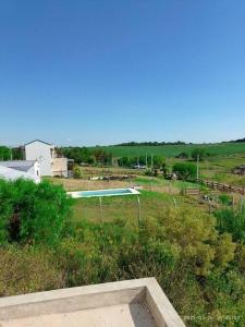 a view of a swimming pool in a field at CASA QUINTA CON ESPECTACULAR VISTA Al RÍO in General Alvear
