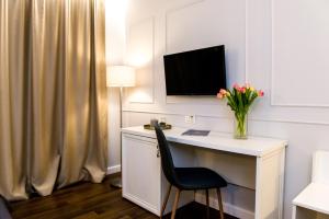 TV a/nebo společenská místnost v ubytování Hotel Ramina