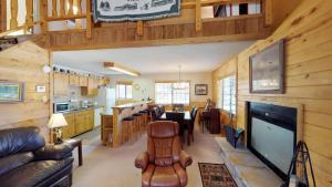 a living room with a kitchen and a dining room at Our Red River Cabin With High Speed Wifi in Red River