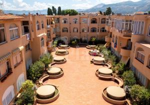 an aerial view of a courtyard in a building at M'Place - Mondello Residence in Palermo