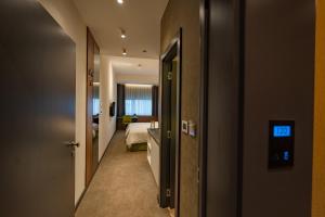Un ou plusieurs lits dans un hébergement de l'établissement Hotel Element