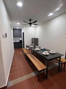 a dining room with a black table and benches at New! 1min to JonkerStreet Melaka loft 4BR 11 PAX in Malacca