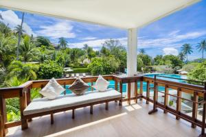 a view from the balcony of a villa with a pool at Ban's Diving Resort SHA Extra Plus in Ko Tao
