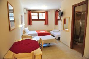 A bed or beds in a room at Pansion Evi