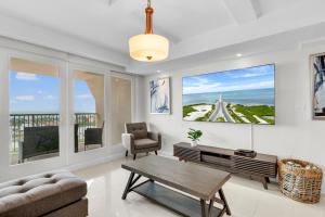 a living room with a couch and a table at Panoramic Island View! NEW 1 BR spacious condo in beachfront resort in South Padre Island