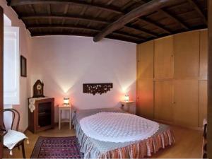 A bed or beds in a room at Nido tra le cupole, terrazza panoramica, Wi-Fi , AC