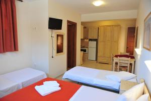 A bed or beds in a room at Pansion Evi