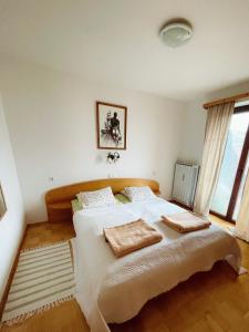 Postel nebo postele na pokoji v ubytování Charming and Cozy Apartment Sara