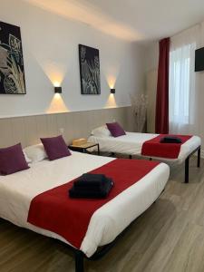 Postel nebo postele na pokoji v ubytování Hôtel Restaurant de l'Union