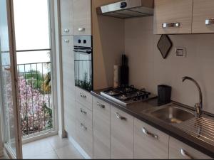 a kitchen with a sink and a stove at Apartments Baricevic in Opatija +72 photos