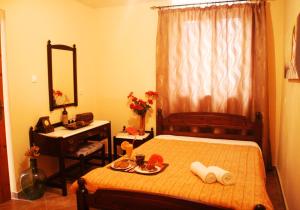A bed or beds in a room at Porofarago