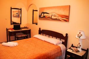 A bed or beds in a room at Porofarago