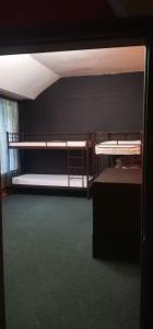 a room with two bunk beds and a wall at Kosher Hostel in Odesa
