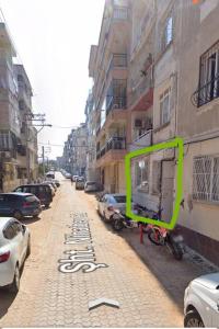 a city street with cars parked on the street at The unit beside historical elevator in Konak