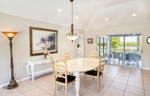 a dining room with a table and chairs at Baywatch Casa home in Captiva