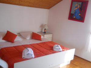 a bedroom with a bed with two towels on it at Apartments Ada Novak in Hvar