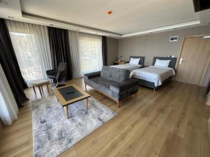 Postel nebo postele na pokoji v ubytování Şehrar Suite Hotel