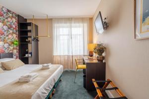 Postel nebo postele na pokoji v ubytování Ama Hôtel