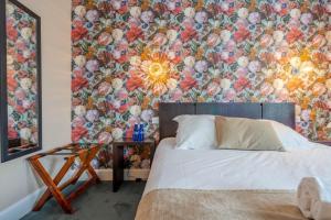 Postel nebo postele na pokoji v ubytování Ama Hôtel