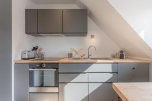 Kuchyňa alebo kuchynka v ubytovaní Appartement neuf & tout confort - Proche Centre ville par Groom