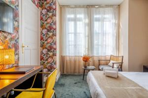 Postel nebo postele na pokoji v ubytování Ama Hôtel