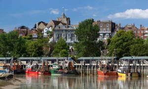 a group of boats are docked at a marina at Wild Sands Next to Beach ✩ Cinema ✩ Living Roof ✩ Games Room in Camber