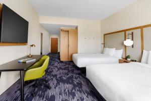 a hotel room with two beds and a desk at Fairfield Inn & Suites Homestead Florida City in Florida City +37 photos
