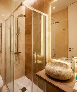 a bathroom with a glass shower and a sink at Luxury flat Salamanca V in Madrid