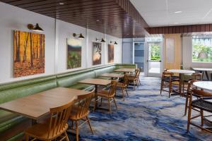 a dining room with wooden tables and chairs at Fairfield Inn & Suites Homestead Florida City in Florida City