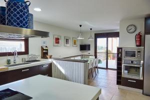 a kitchen with a sink and a counter top at Villa Alcotán Layos by Toledo AP in Layos