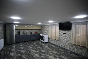 Kuchyň nebo kuchyňský kout v ubytování Guest House Nikola