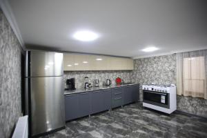 Kuchyň nebo kuchyňský kout v ubytování Guest House Nikola