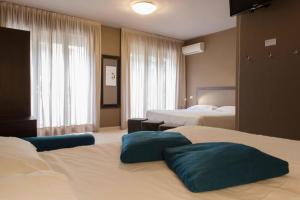 Postel nebo postele na pokoji v ubytování M14 Hotel & Spa