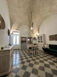 a large living room with a checkered floor at Casa in stile in Pezze di Greco
