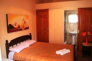A bed or beds in a room at Porofarago