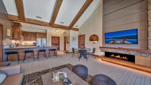 a living room with a fireplace and a tv at Luxury Residence - Gondola Across The Street Condo in South Lake Tahoe