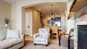 a living room with a couch and a dining room at Pebble Beach Oasis home in Washington