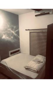 Ein Bett oder Betten in einem Zimmer der Unterkunft Redbell Inn Airport Hotel