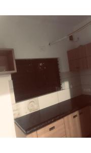 een keuken met een grote flatscreen-tv bij Redbell Inn Airport Hotel in Kondotti