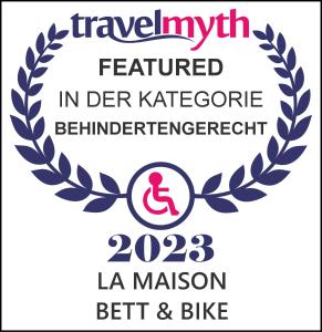 a logo for a translation festival with a laurel wreath at La Maison Bett & Bike in Pritzwalk