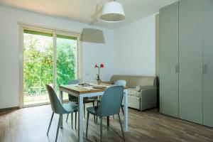 a dining room with a table and chairs at Residence San Francesco in Tirrenia