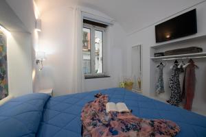 Katil atau katil-katil dalam bilik di Strit strit centro storico
