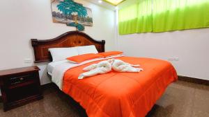 Postel nebo postele na pokoji v ubytování Hostal La Siesta