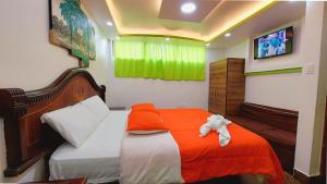 Postel nebo postele na pokoji v ubytování Hostal La Siesta