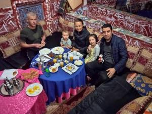 a group of people sitting around a table at Riad DAR outebba 