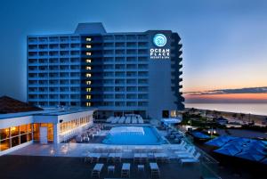 a view of the ocean palace hotel at dusk at Ocean Place Resort & Spa in Long Branch