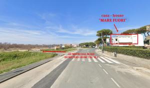 a road with a sign that says make truck at Appartamento Mare Fuori a Vada by Zoom In Earth in Vada