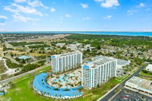 an aerial view of a resort with a pool and the ocean at Palms of Destin by Panhandle Getaways in Destin