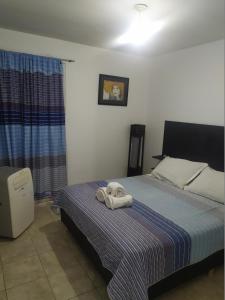 Postel nebo postele na pokoji v ubytování DPTO ALTA CORDOBA